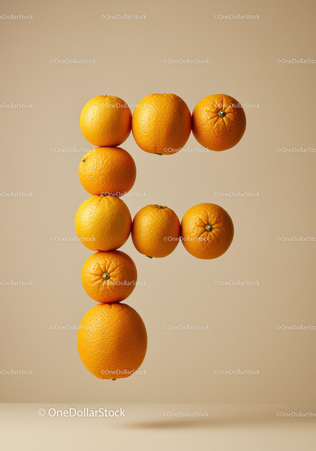 Creative Letter F Formed by Floating Oranges
