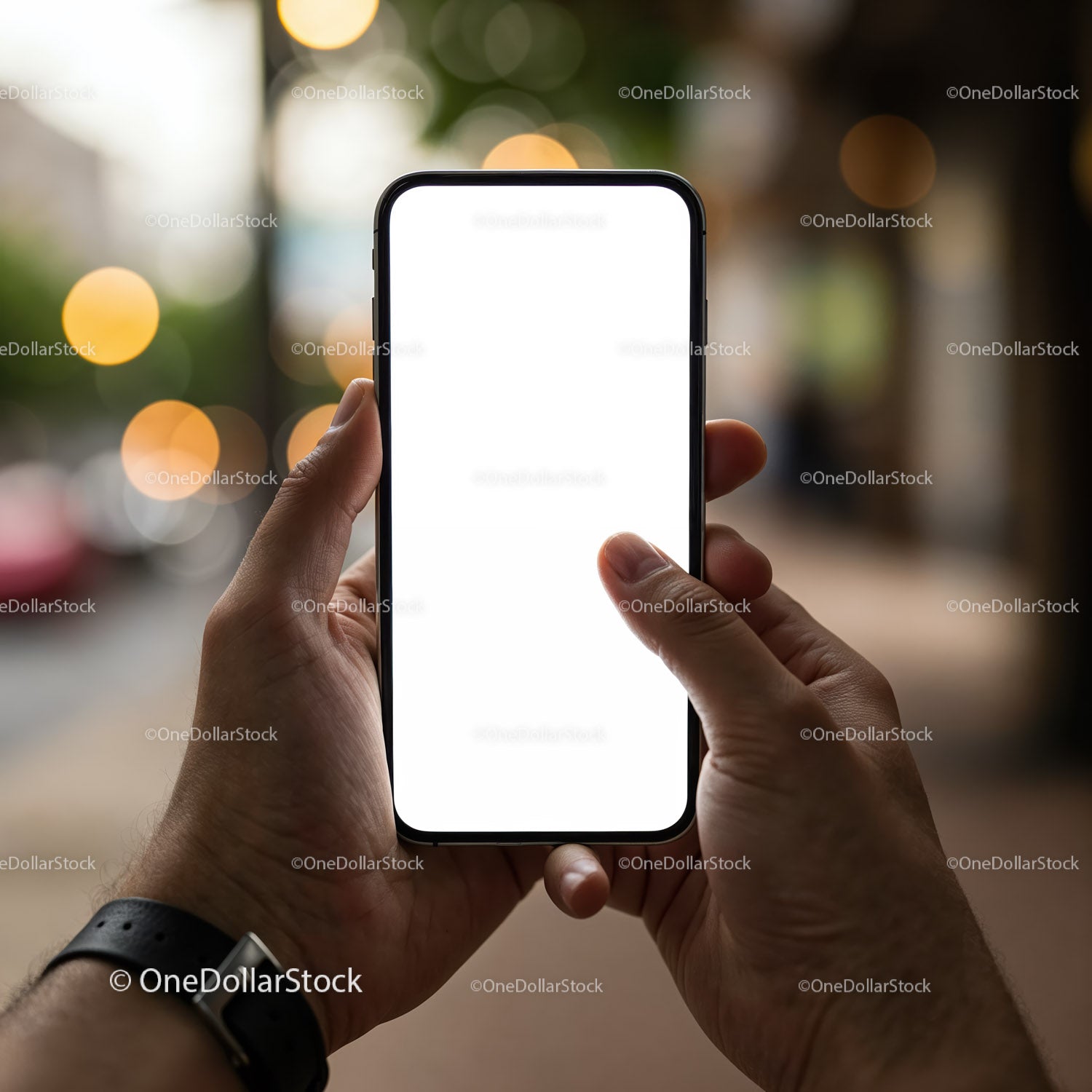 Person Holding Smartphone with Blank White Screen Outdoors