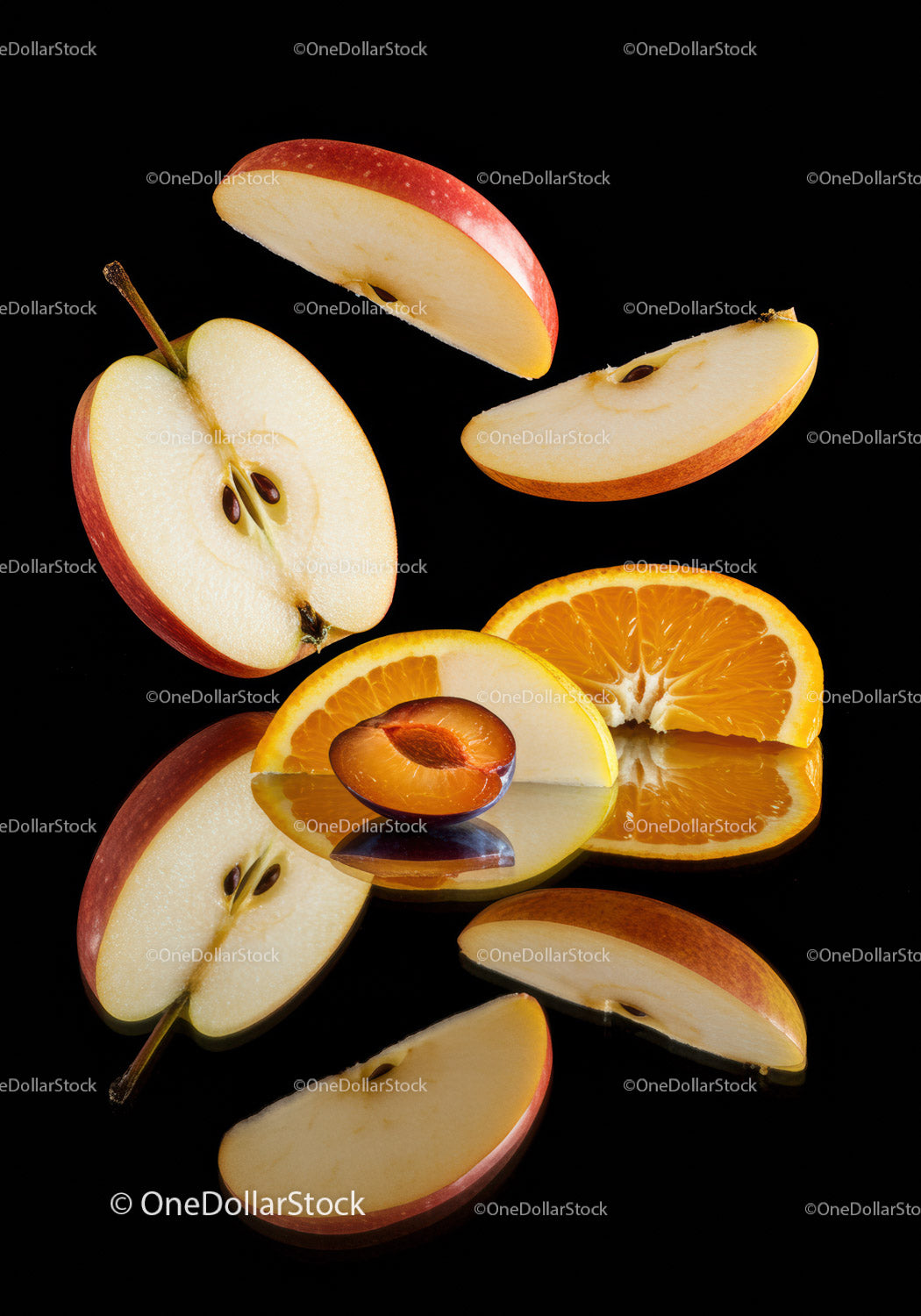 Fresh Sliced Fruits Composition on Black Surface