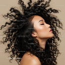 Calm woman with flowing curly hair in profile pose