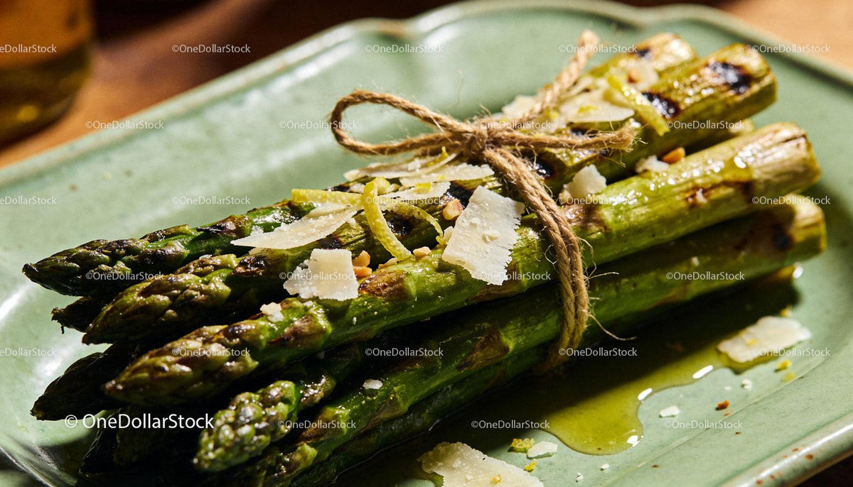 Grilled asparagus bundle with shaved parmesan and zest