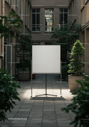 Blank Whiteboard in Quiet Urban Courtyard with Plants