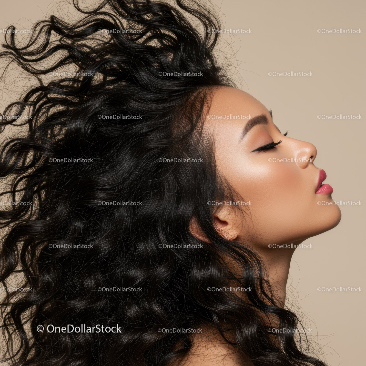 Profile of woman with flowing curly hair and smooth skin