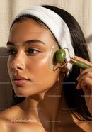 Young Woman Using Jade Roller for Facial Skincare Relaxation
