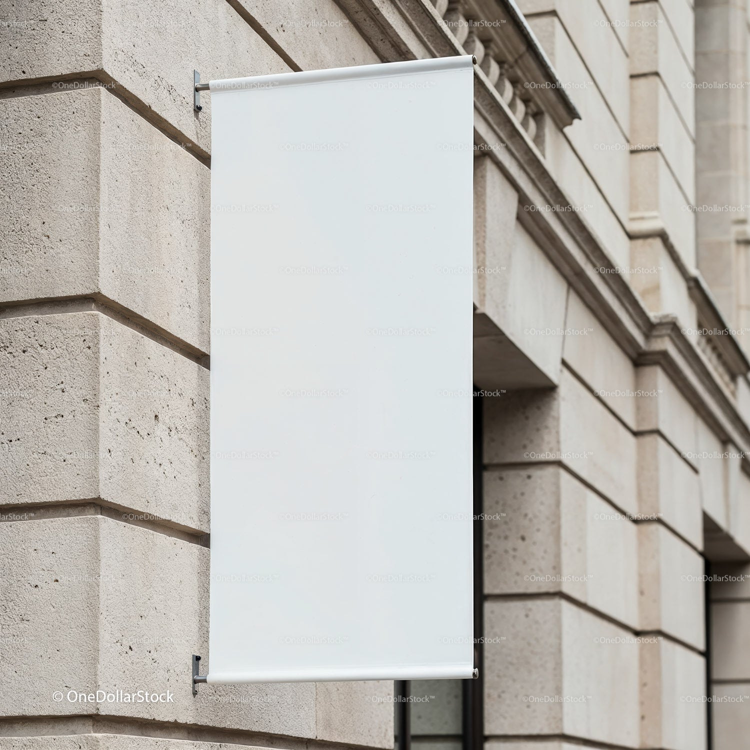 Blank vertical banner on stone wall in urban setting