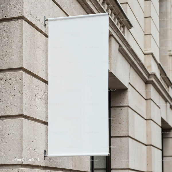 Blank vertical banner on stone wall in urban setting JPG Mockup Image