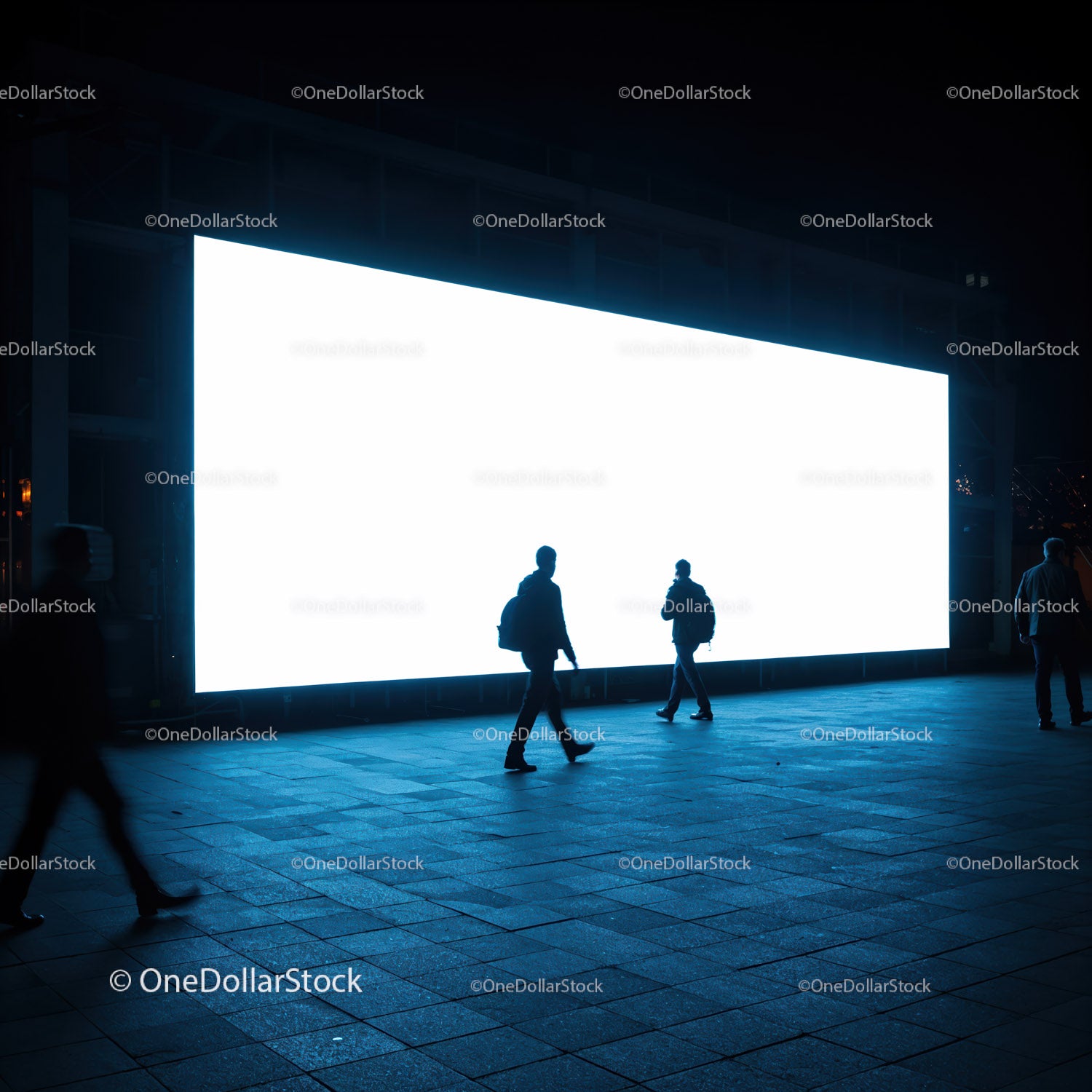 People Walking Past Large Bright Digital Billboard at Night