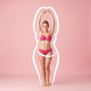 Young Woman in Pink Bikini Stretching Against Pink Background