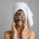 Young Woman Applying Facial Mud Mask for Skin Rejuvenation and Relaxation