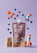 Blueberry smoothie with playful rocket toys and blocks