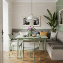 Modern Dining Corner with Green Table and Leafy Plant for Stylish Home