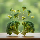 Fresh broccoli florets levitating above wooden surface