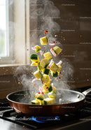 Fresh zucchini and onion sauté tossed in copper pan