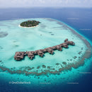 Overwater Bungalows Surrounded by Turquoise Lagoon on a Tropical Island