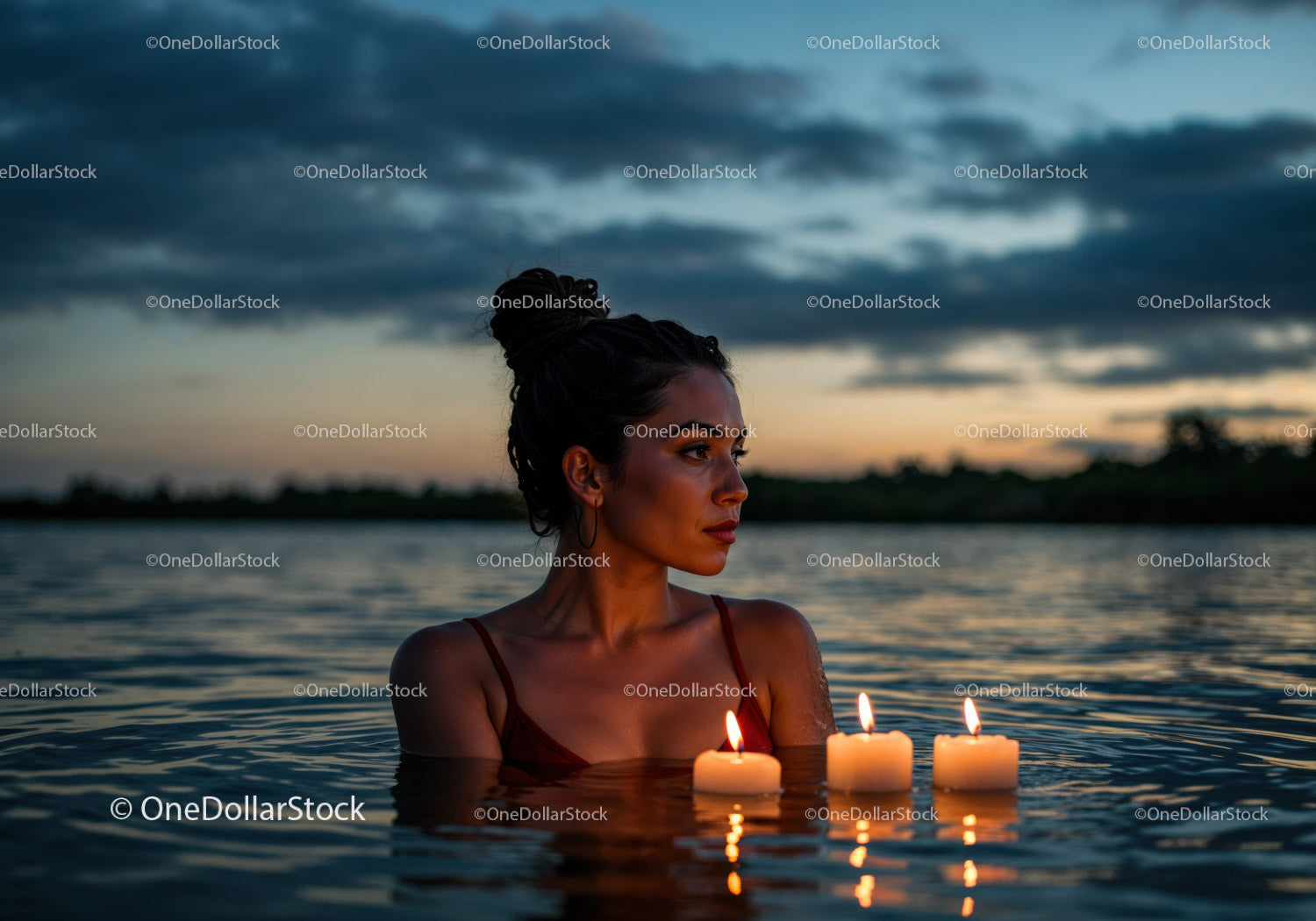 Woman in Black Bikini with Candles Floating in Lake at Sunset