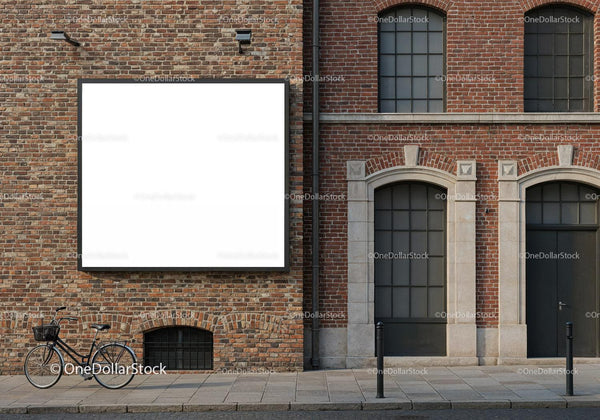 Vintage bicycle parked near brick building with blank billboard JPG Mockup Image