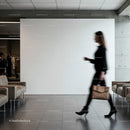 Blurred woman walking through modern minimalist lobby
