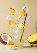 Refreshing Pineapple Coconut Drink with Ice Cubes Splash