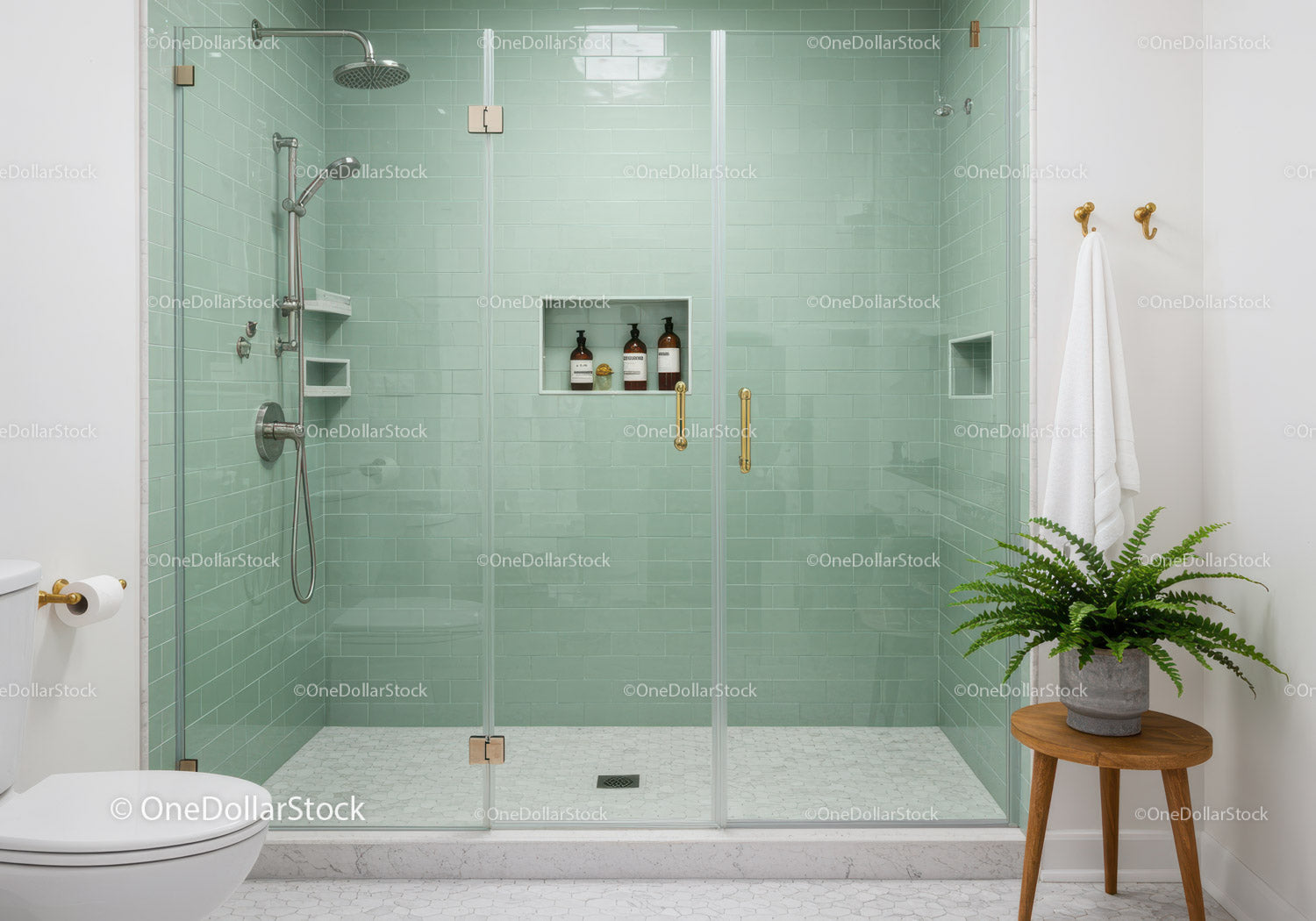 Modern bathroom with glass shower and green tiles