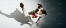 Happy dog wearing red bow tie reaching paw upwards
