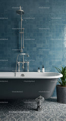Classic clawfoot bathtub with blue tiled bathroom wall