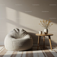 Cozy beige bean bag and wooden table with dried flowers