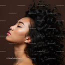 Profile of serene woman with voluminous curly black hair