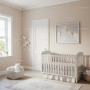 Elegant Baby Nursery with White Crib and Soft Pastel Decor
