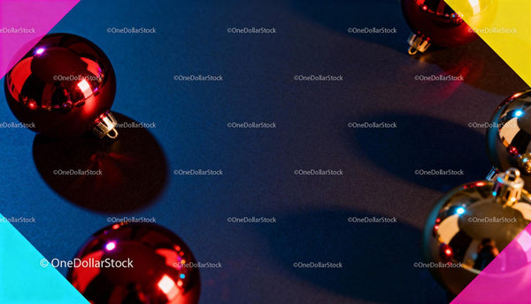 Glossy Christmas baubles arranged on dark surface