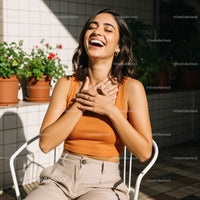 Joyful Woman Laughing in a Bright Outdoor Setting