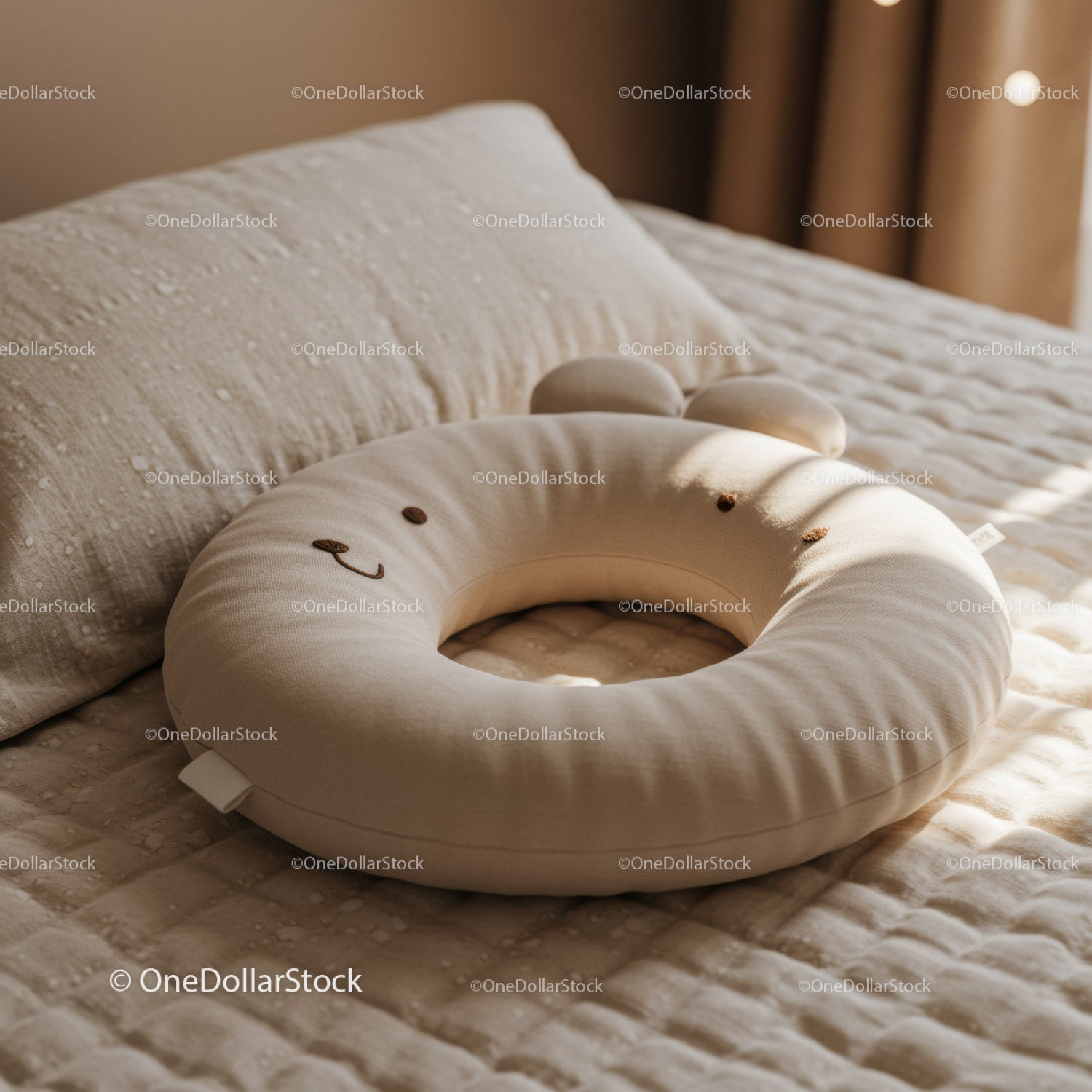 Soft animal shaped baby nursing pillow on cozy bed