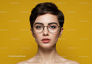 Portrait of a Stylish Woman with Short Hair and Glasses on Yellow Background
