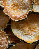 Close-Up of Frosted Orange Slices with Ice Crystals