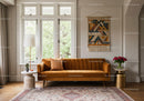 Modern Living Room with Velvet Sofa and Artistic Wall Decor