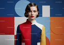 Woman in Bold Colorblock Dress with Artistic Background