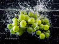 Green Grapes Splashing into Water Fresh Fruit with Vibrant Colors