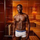 Confident Male Model in Sauna with Wooden Interior and Warm Lighting