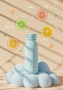 Blue bottle on soft cloud with citrus illustrations