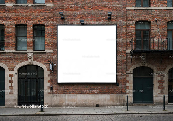 Empty square billboard on historic brick building facade JPG Mockup Image