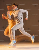 Man in beige tracksuit running with motion blur