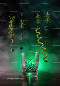 Suspended herbs and berries above decorative glass