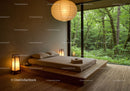 Minimalist bedroom with forest view and warm lighting