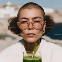 Stylish Young Woman with Short Hair Wearing Trendy Sunglasses Outdoors