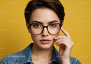 Elegant Young Woman with Glasses Portrait on Yellow Background