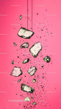 Flying Rocks and Debris on Bright Pink Background