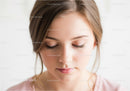 Portrait of a Young Woman with Beautiful Skin and Soft Makeup