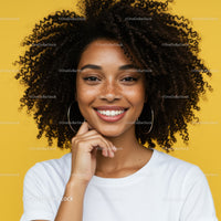 Smiling Woman with Curly Hair and Bright Background