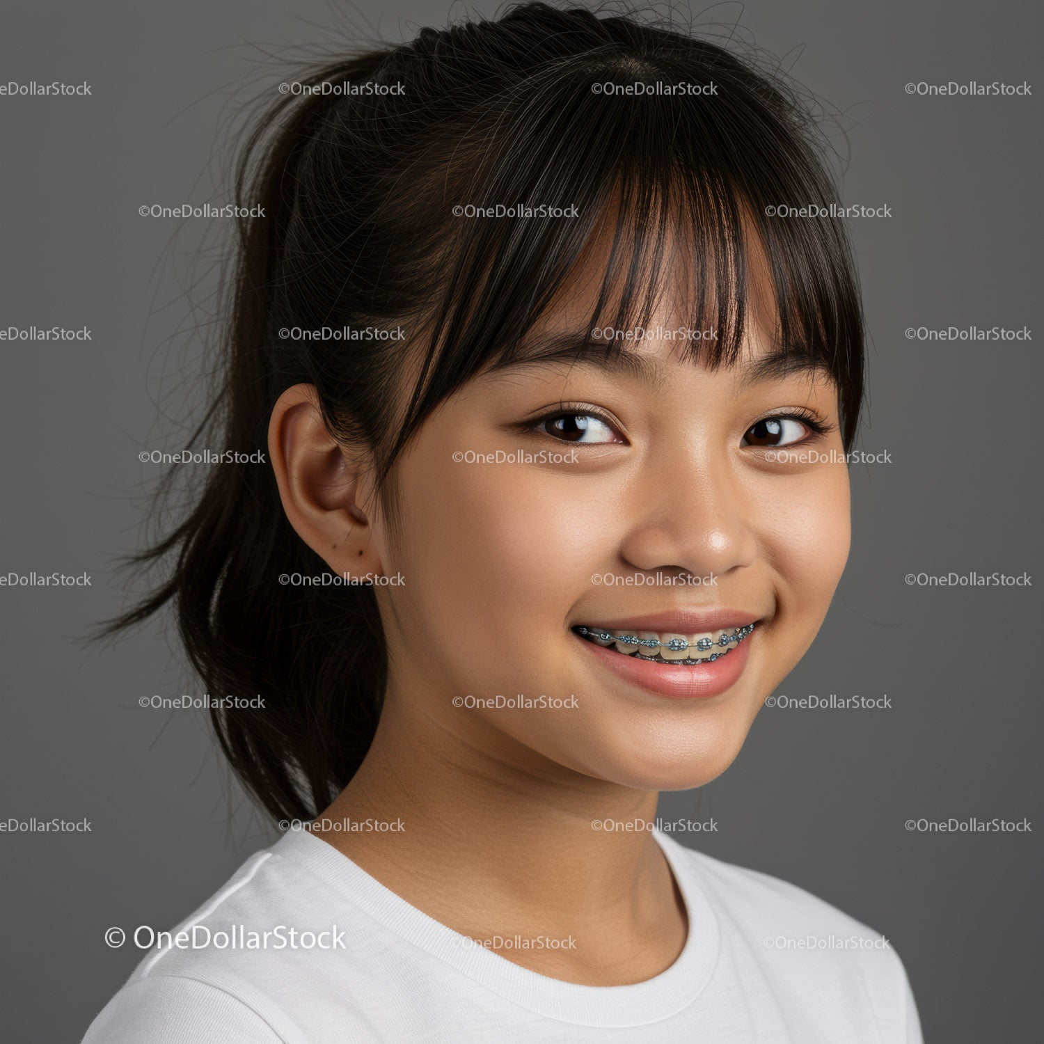 Young Girl Smiling with Braces in Casual Indoor Setting