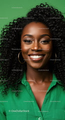 Portrait of a Smiling Woman with Curly Hair Wearing a Green Shirt