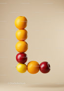 Stacked fresh citrus and apples forming L shape